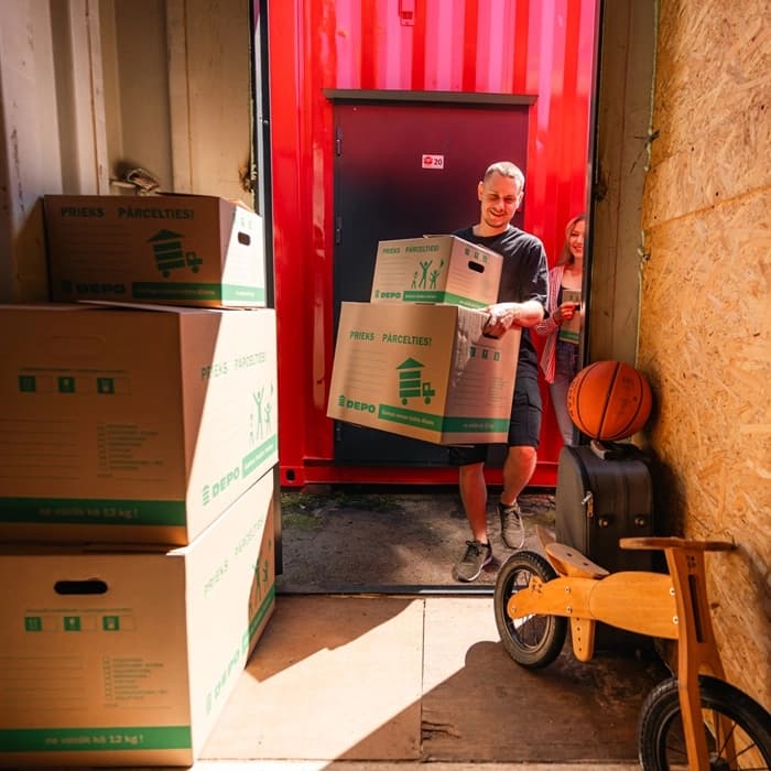 Worker packing items into boxes for storage or shipping